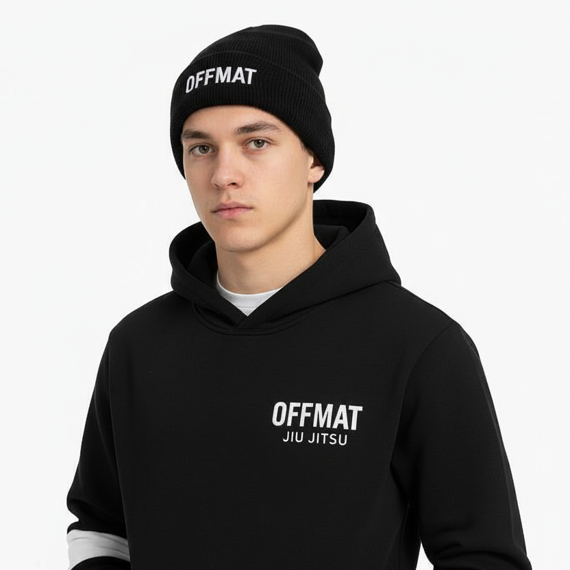 Person wearing a black hoodie and beanie with 'OFFMAT' branding on a white background